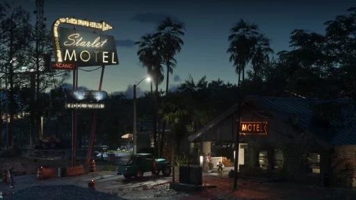 Ночной придорожный мотель с неоновой вывеской Starlet Motel и табличкой Vacancy, у входа зелёный пикап и пальмы
